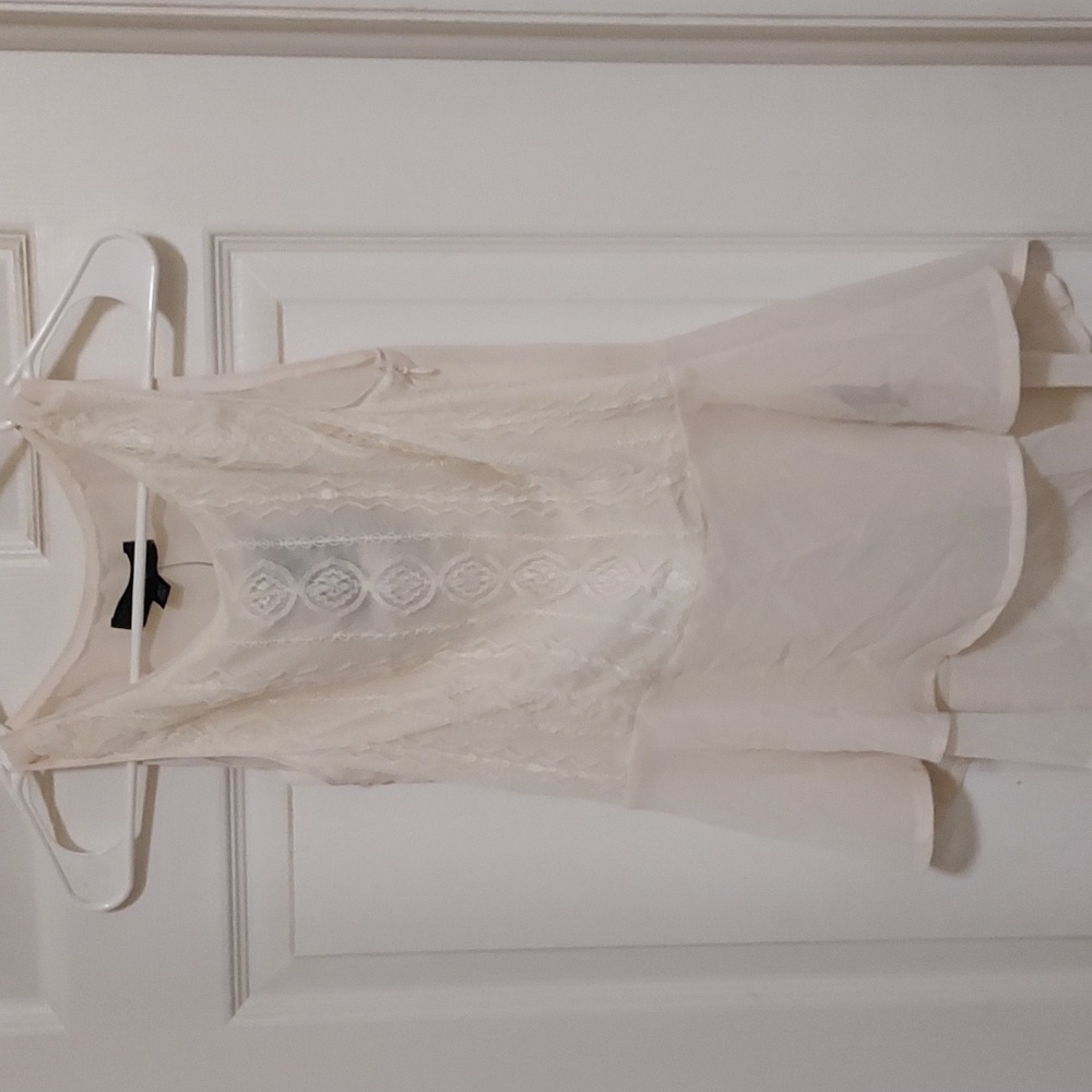 Cream colored lace front/sheer back sleeveless top